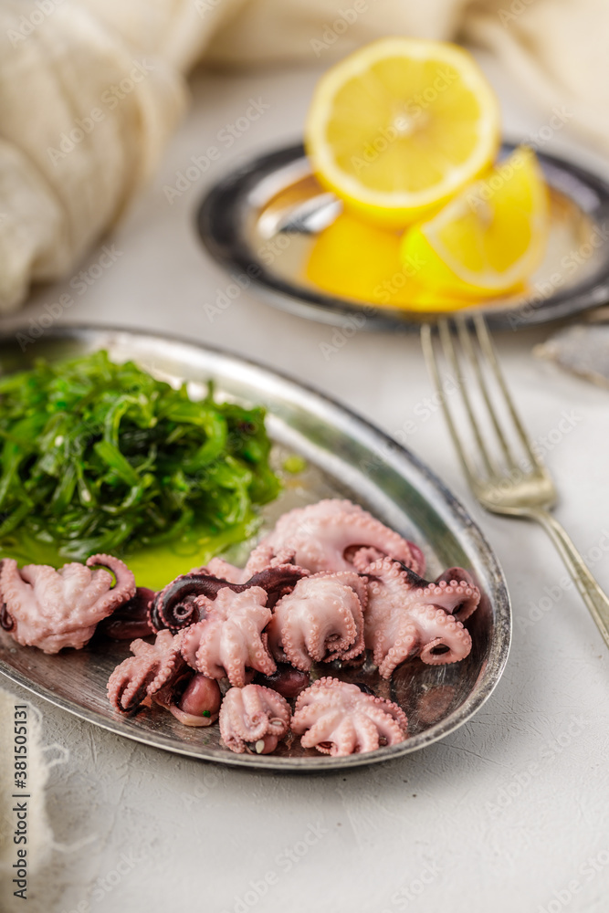 Traditional asian food. Delicious boiled octopus with fresh wakame salad. Traditional asian food. Delicious boiled octopus with fresh wakame salad.