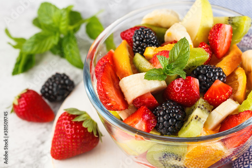 Delicious fruit salad on a plate on table.