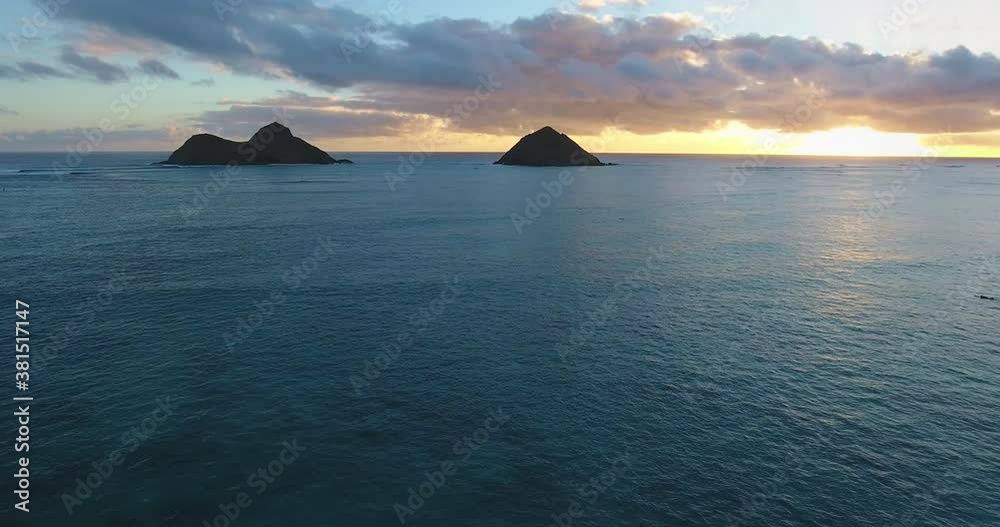 Tropical sunset over islands in Hawaii, wide aerial Tropical sunset over islands in Hawaii, wide aerial