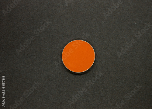 Neon Orange Eyeshadow isolated on a Black background