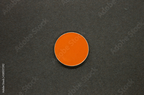 Neon Orange Eyeshadow isolated on a Black background