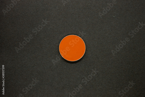 Neon Orange Eyeshadow isolated on a Black background