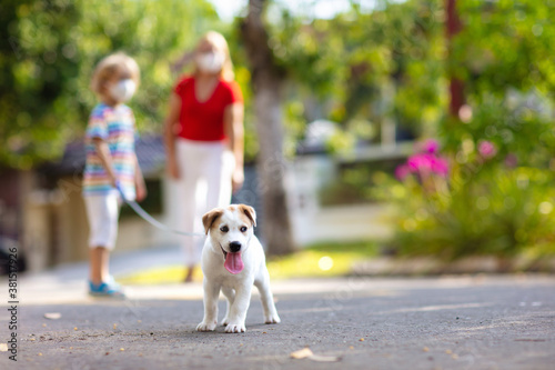 Family walking dog during virus outbreak