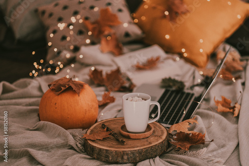A good autumn and halloween afternoon enjoying a cup of hot chocolate with trinkets in my bed