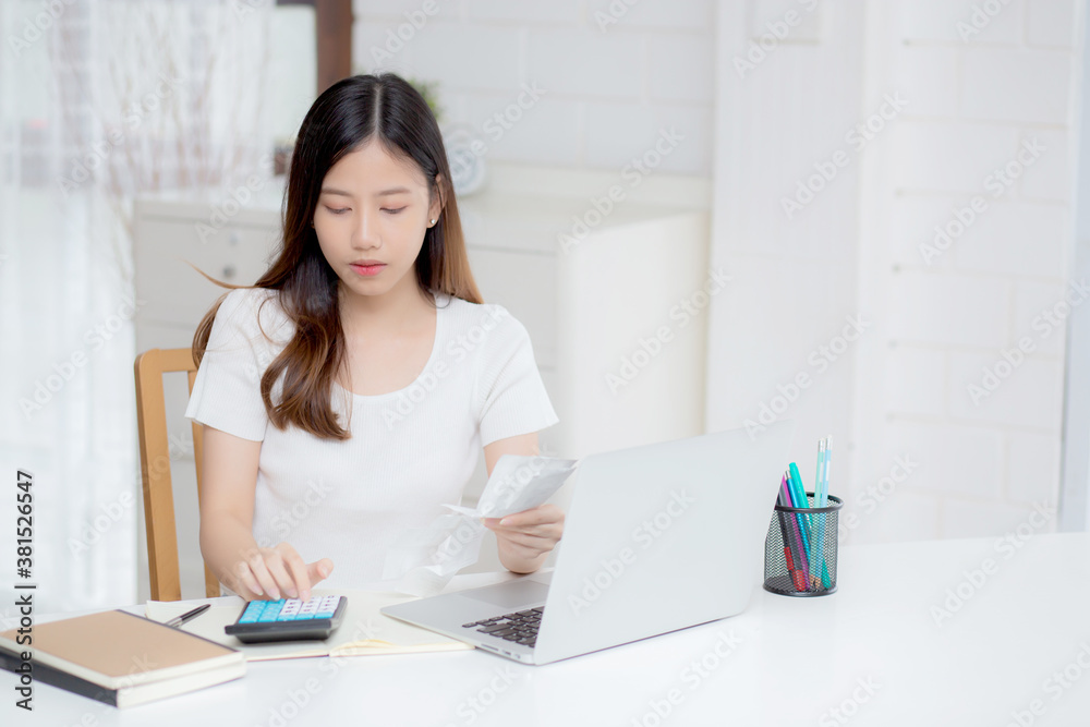 Young asian woman calculating expenses household about finance and frustrated on desk at home, girl checking bill having stress and worried, debt and tax, expression and emotion, business concept. Young asian woman calculating expenses household about finance and frustrated on desk at home, girl checking bill having stress and worried, debt and tax, expression and emotion, business concept.