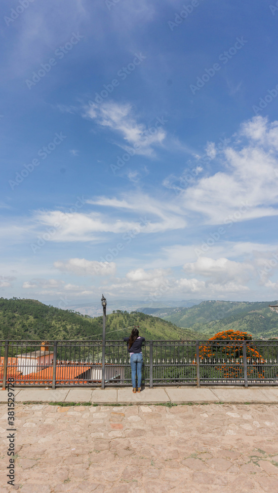 Woman enjoying Santa Lucia view in Fracisco Morazan Honduras Woman enjoying Santa Lucia view in Fracisco Morazan Honduras