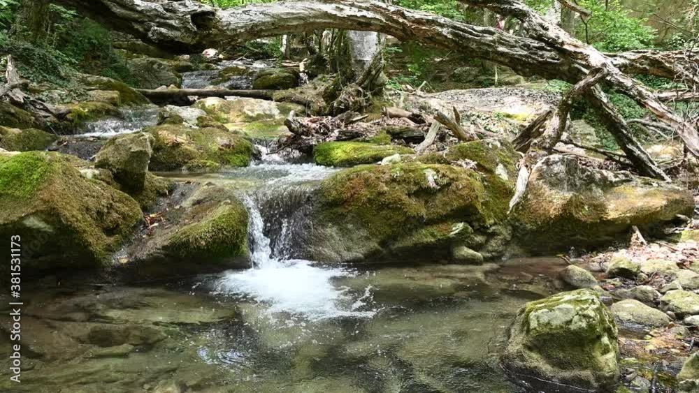 beautiful waterfall in a mountain forest, Mountain stream, mountain waterfall beautiful waterfall in a mountain forest, Mountain stream, mountain waterfall