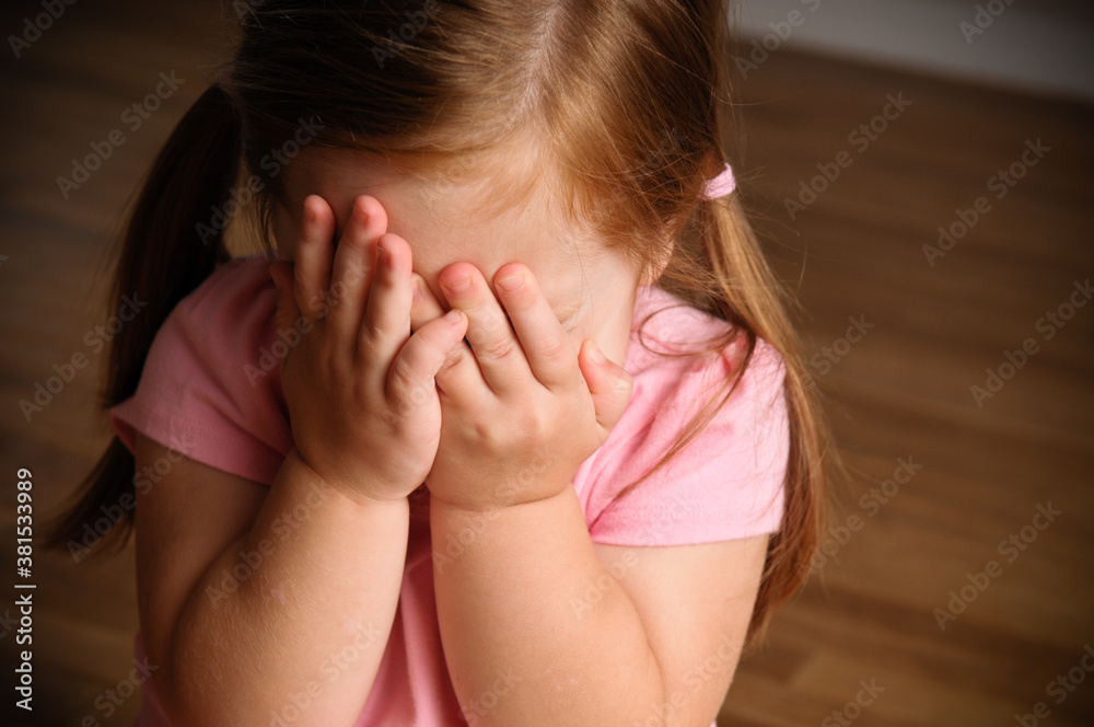 Shy Little Girl Sitting Sitting on Floor Inside Home Shy Little Girl Sitting Sitting on Floor Inside Home