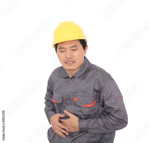 Construction migrant worker with stomach ache in front of white background photo