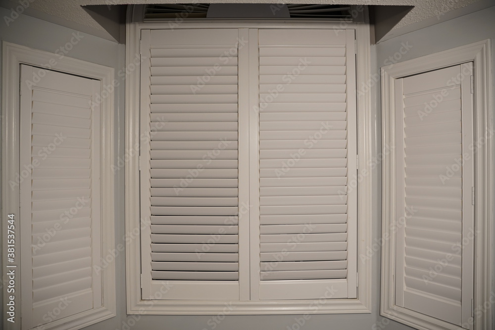 Fototapeta premium white wooden window with shutters