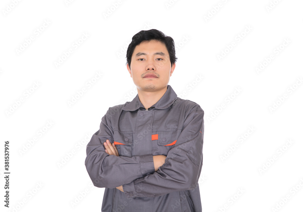 Male worker holding hands standing in front of white background Male worker holding hands standing in front of white background