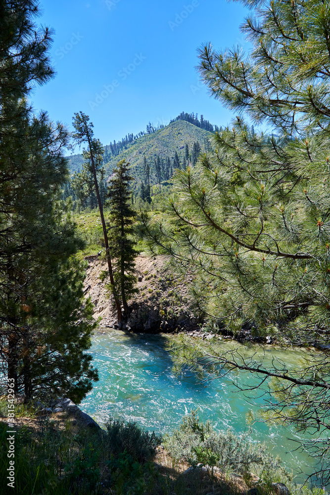 Obraz premium Photo of clear mountain stream racing down the slope in the mountains in western Idaho, USA