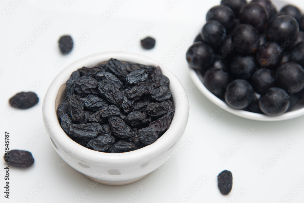 Black raisins or dried black grapes organic dried grapes healthy sweet. prepared by drying the fruit in full sun Black raisins or dried black grapes organic dried grapes healthy sweet. prepared by drying the fruit in full sun