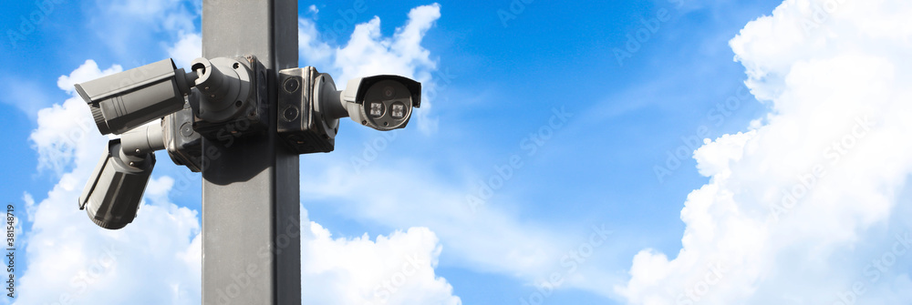 Multi-angle CCTV system on blue sky background.