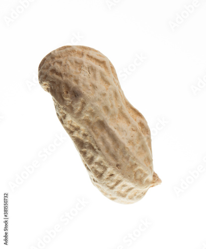 Unpeeled peanut isolated on white