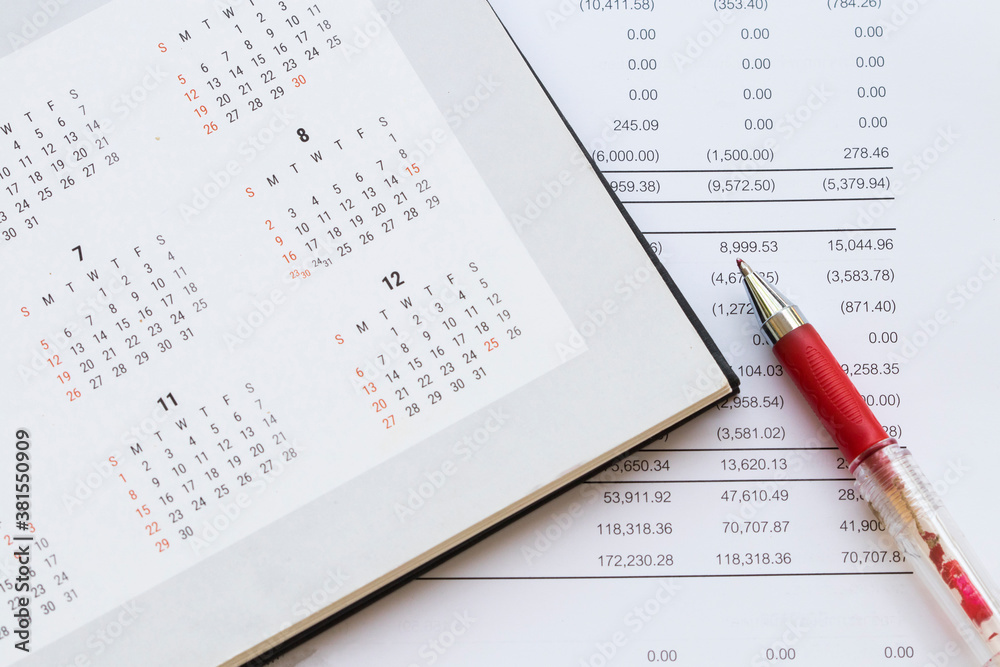 financial statement for check with calendar for business work of personal arrangement flat lay style at office desk financial statement for check with calendar for business work of personal arrangement flat lay style at office desk