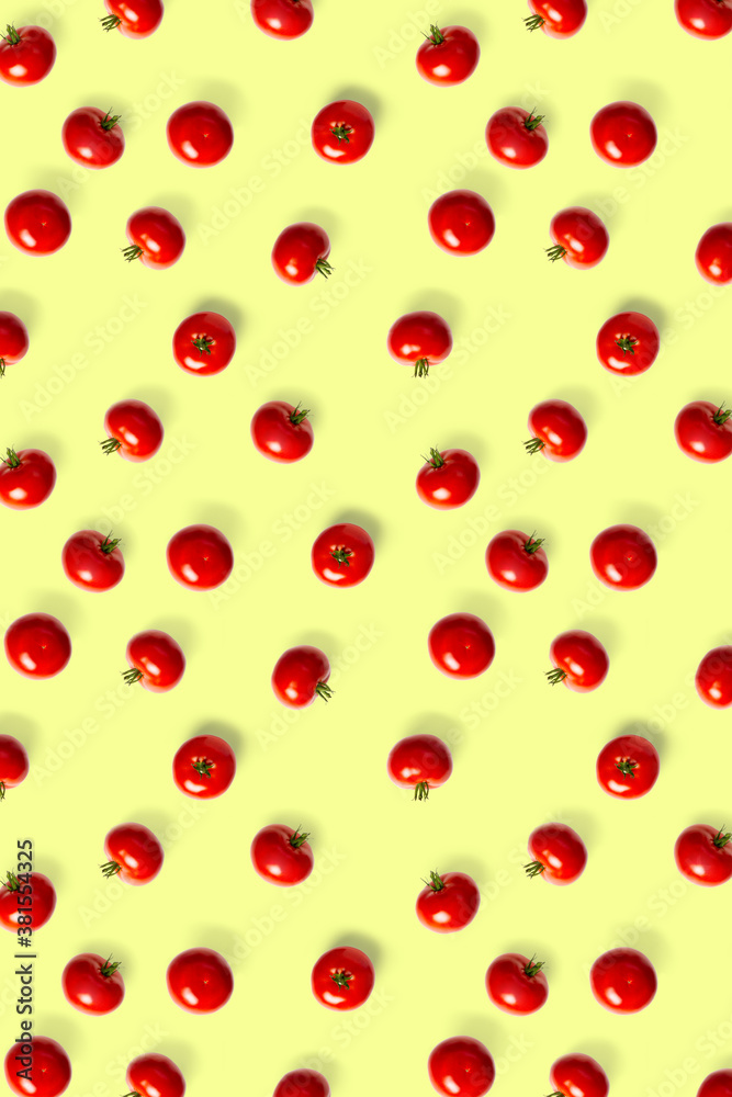 creative background from red tomatoes. Abstract background. of isolated ripe Tomato on the yellow background not seamless pattern creative background from red tomatoes. Abstract background. of isolated ripe Tomato on the yellow background not seamless pattern