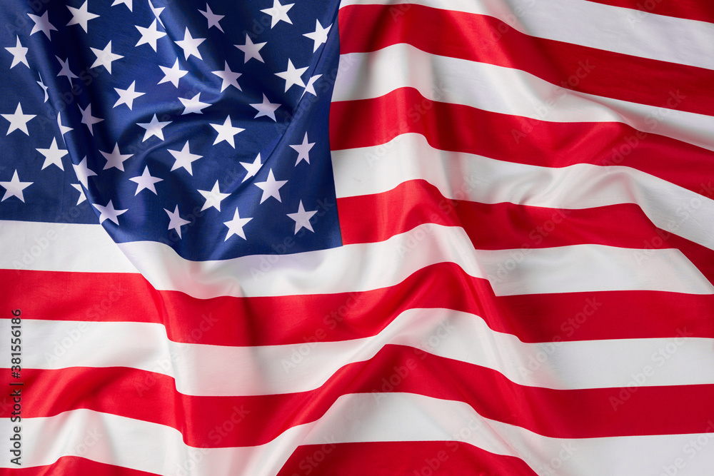 Close up of ruffled American flag. Satin texture curved flag of USA. Memorial Day or 4th of July. Banner, freedom concept