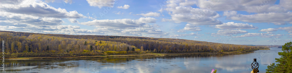 Beautiful, wide river autumn among the woods. Panorama Beautiful, wide river autumn among the woods. Panorama