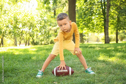 Little boy playing American...