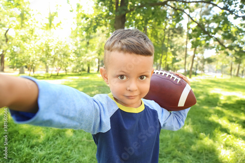 Little boy with rugby ball ...