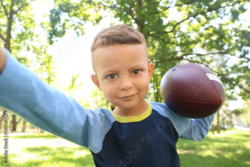 Little boy with rugby ball ...