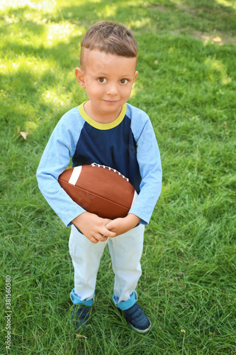 Little boy playing American...