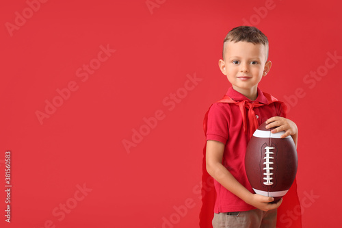 Little boy with rugby ball ...