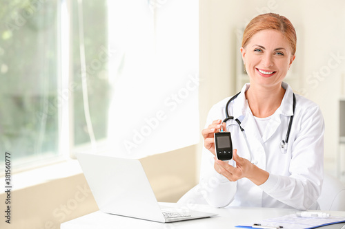 Doctor with digital glucome...