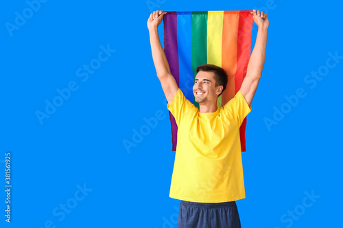 Young man with LGBT flag on...