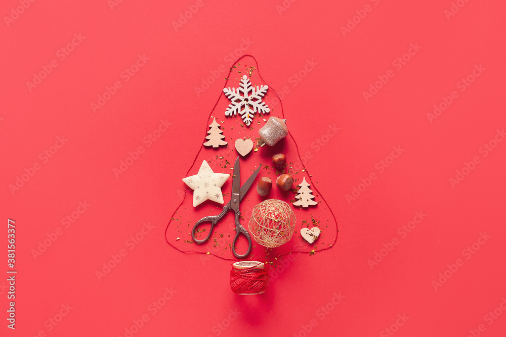 Christmas tree made of New Year decor on color background
