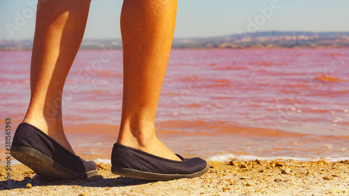 Woman on pink lake in Spain