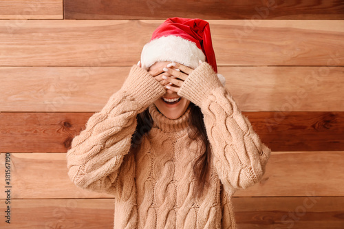 Happy young woman in Santa ...