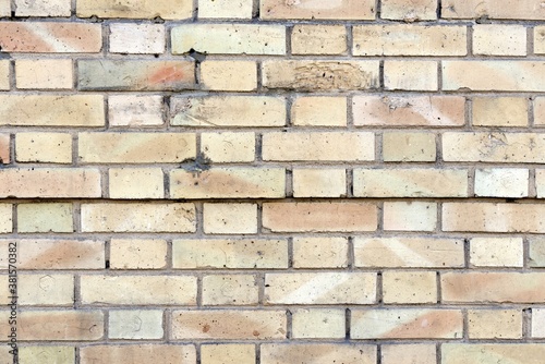 Wall made up of faded colored bricks looking stunning in rectangular pattern