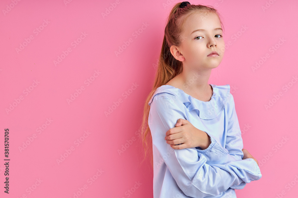 sad sleepy girl looks detached , she is posing at camera, isolated on pink background sad sleepy girl looks detached , she is posing at camera, isolated on pink background
