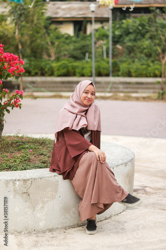 Fashion portrait of young beautiful asian muslim woman with wearing hijab.