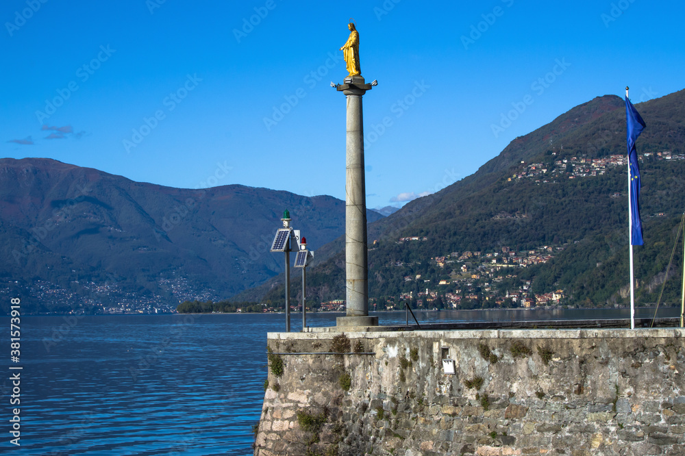 panoramic view from the small characteristic port of Luino, a tourist town overlooking Lake Maggiore in Lombardy, Italy