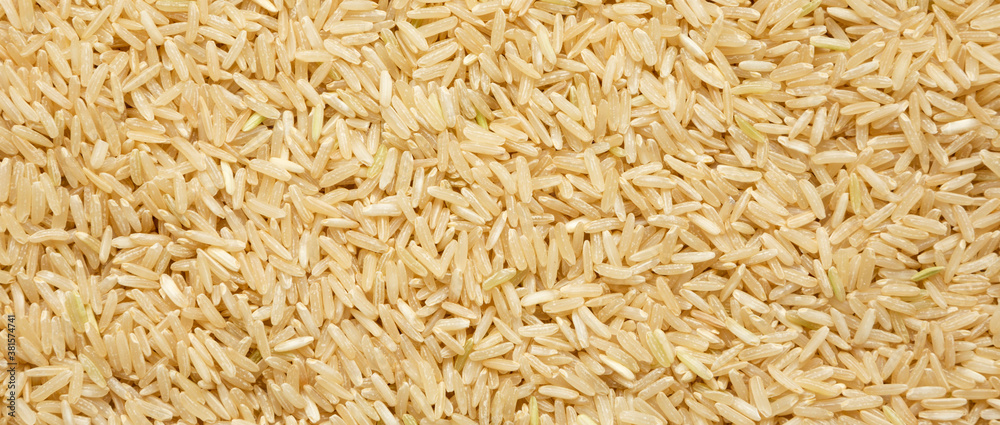 Dry Brown Rice background, view from above. Overhead, top view, flat lay. Dry Brown Rice background, view from above. Overhead, top view, flat lay.