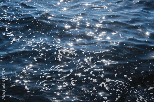 Sun rays reflected from the sea surface. The foams on the sea.