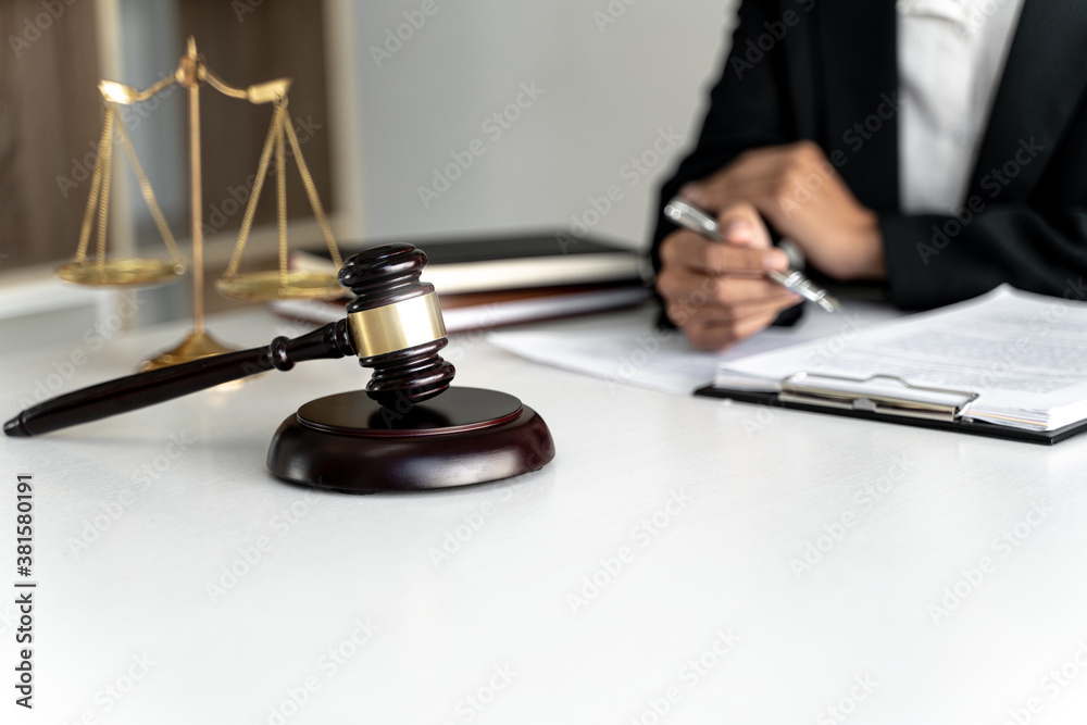 Lawyer working with lawsuit in courtroom, Criminal and judgement concept. Lawyer working with lawsuit in courtroom, Criminal and judgement concept.