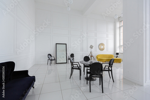 modern fashionable futuristic interior design of a spacious white hall with black and yellow furniture © 4595886