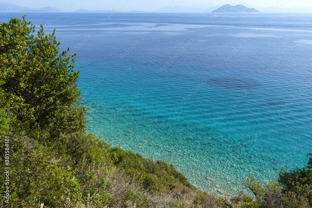 Beautiful turquoise paradise secluded pebble beach of Gidaki only accessible by path, Ithaki or Ithaca island, Ionian, Greece