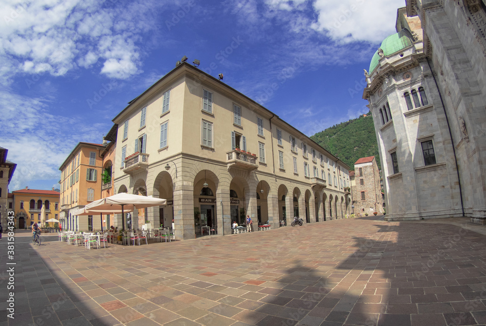 Downtown deserted city square scene at afternoonHistoric center of Como,view on cathedral and arcades.