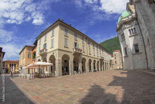 Downtown deserted city square scene at afternoonHistoric center of Como,view on cathedral and arcades.