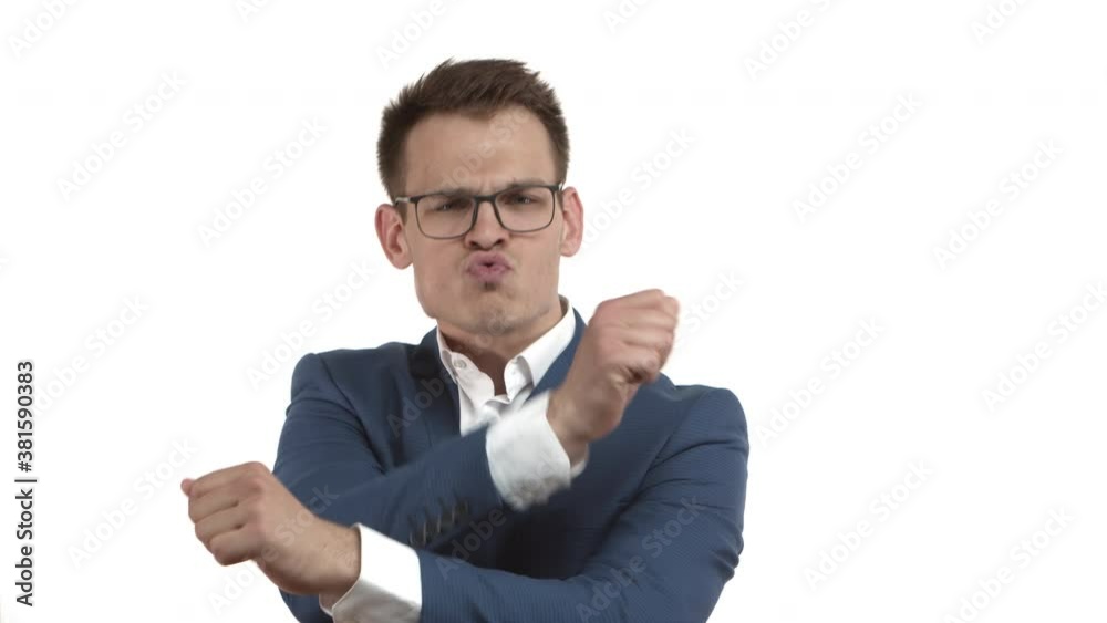 Carefree happy businessman in blue suit and glasses, playing on invisible drums and vibing, standing over white background Carefree happy businessman in blue suit and glasses, playing on invisible drums and vibing, standing over white background