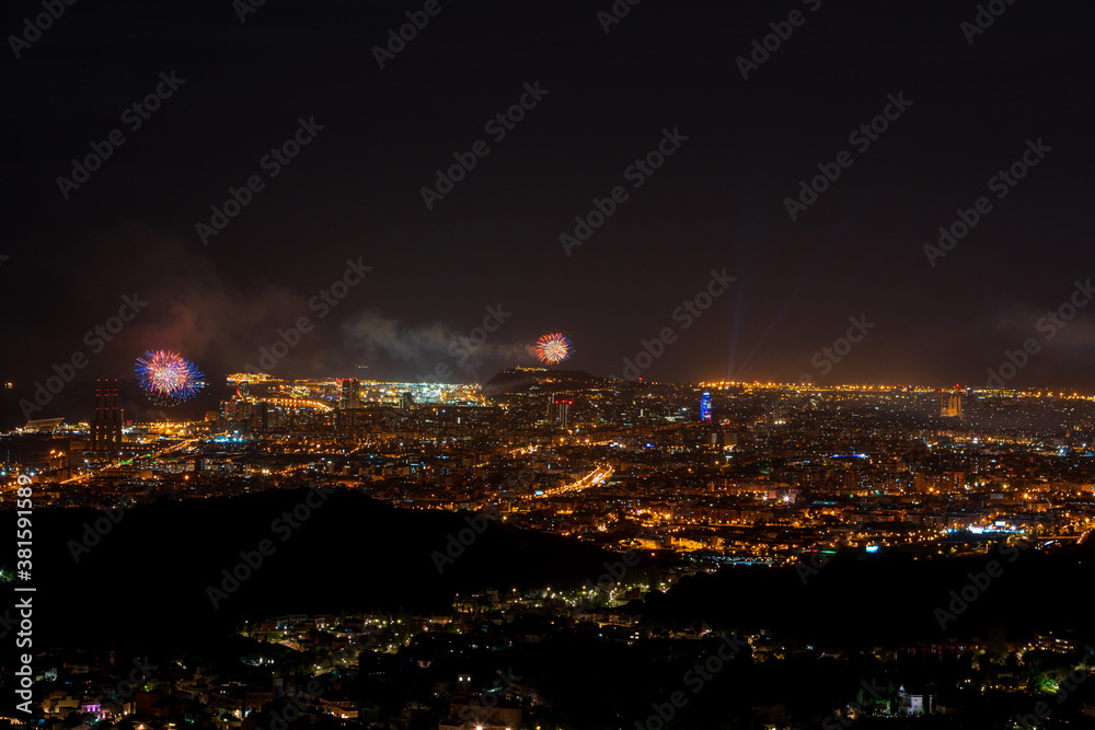 Naklejka premium Final of the festival of La Mercè 2020 with fireworks distributed throughout the city of Barcelona in order not to generate crowds of people to avoid COVID-19.