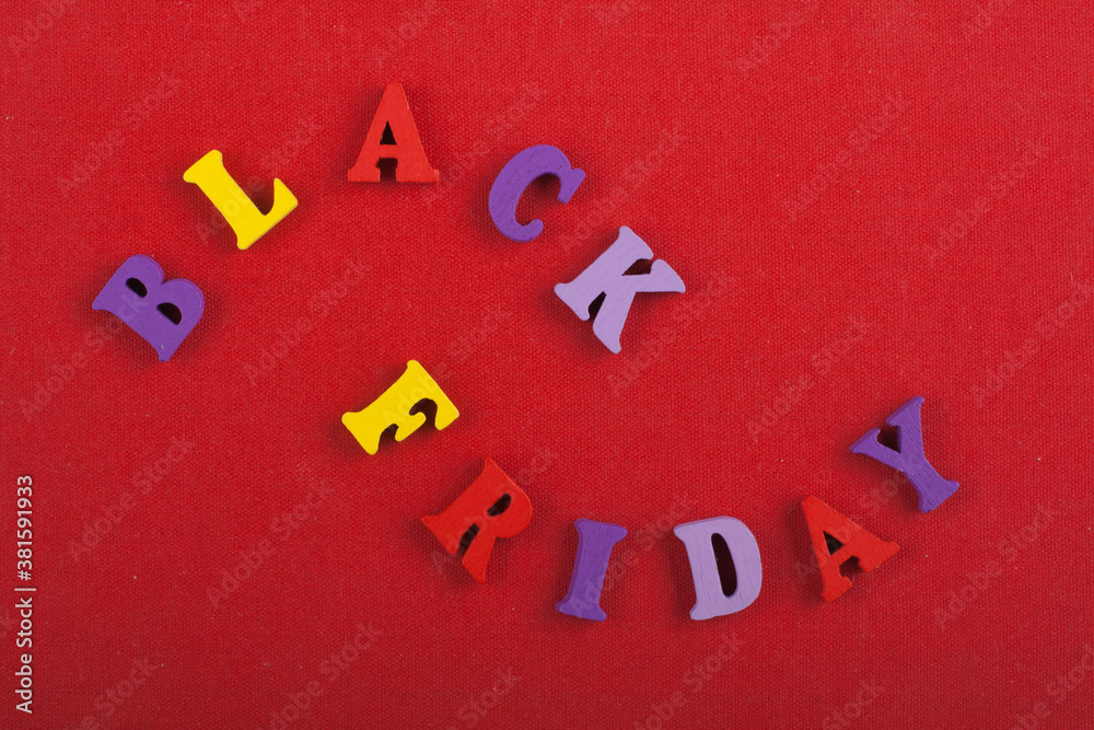 BLACK FRIDAY word on red background composed from colorful abc alphabet block wooden letters, copy space for ad text. Learning english concept. BLACK FRIDAY word on red background composed from colorful abc alphabet block wooden letters, copy space for ad text. Learning english concept.