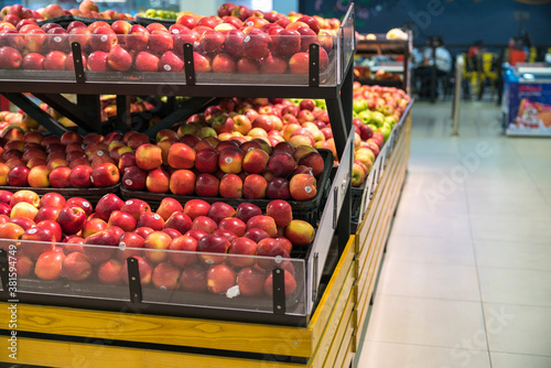 Fresh healthy fruits on shelves in supermarket
