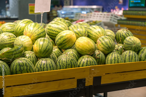 Fresh healthy fruits on shelves in supermarket