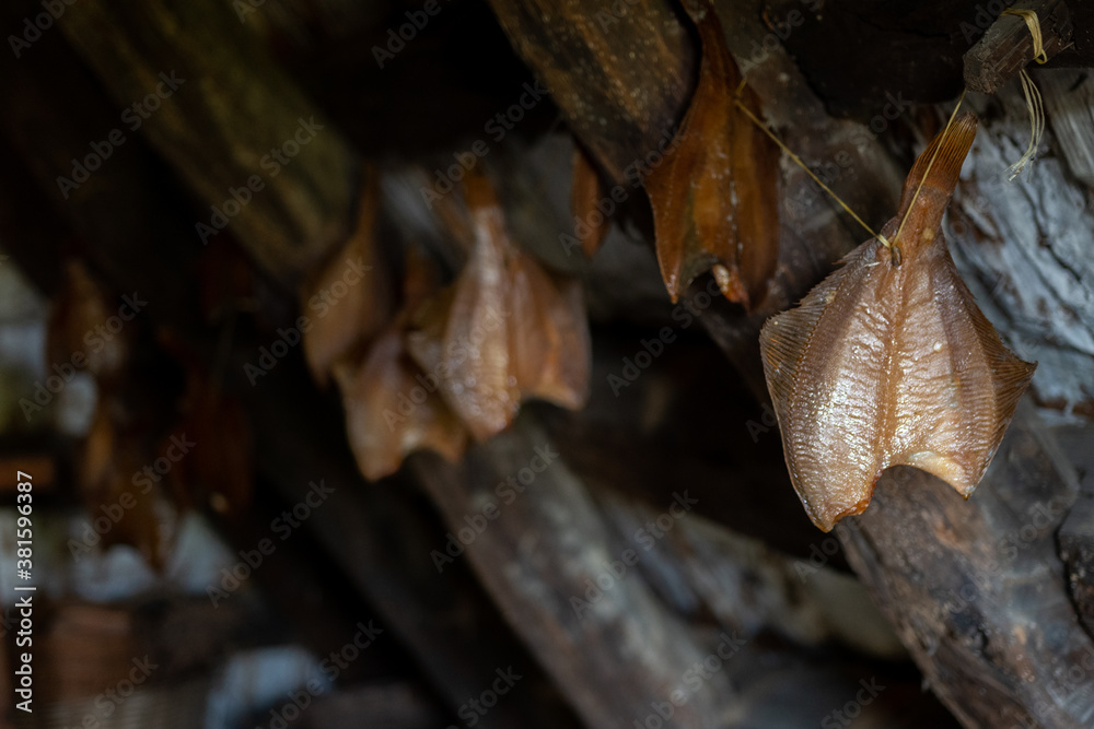 Traditional scandinavian dried fish dries on a line Traditional scandinavian dried fish dries on a line